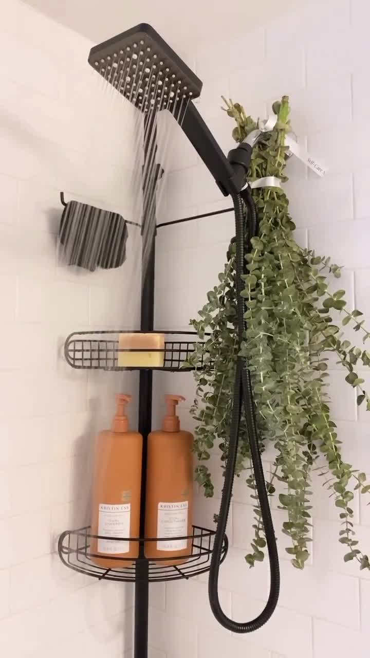 Self Care Shower eucalyptus bouquet hanging beside a shower fixture